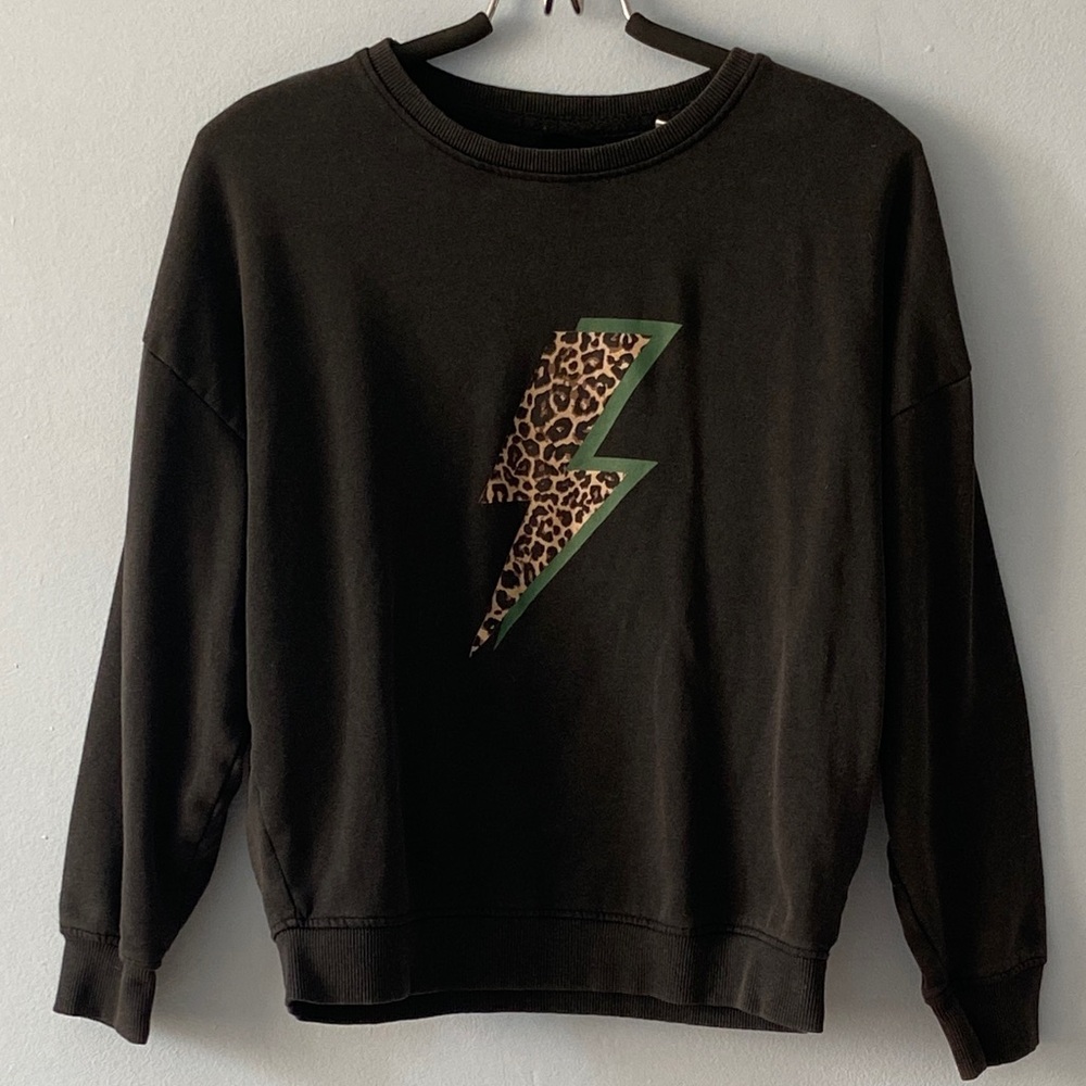 Black crewneck pullover sweater in size small, featuring a leopard bolt graphic.